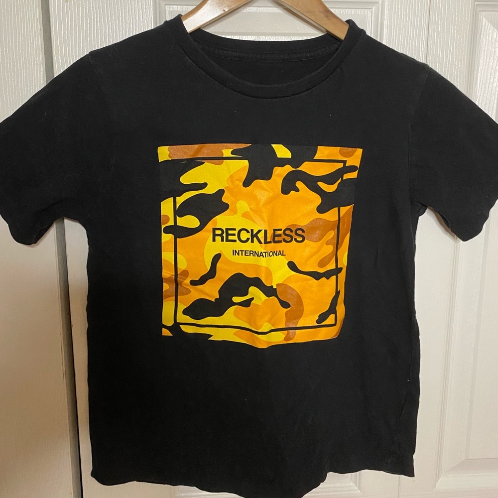 Black and orange reckless tee-shirt. Size youth m